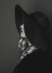 Beautiful blonde girl in a hat.