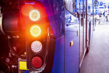 taillights of a city bus at a public transport stop - 471428105