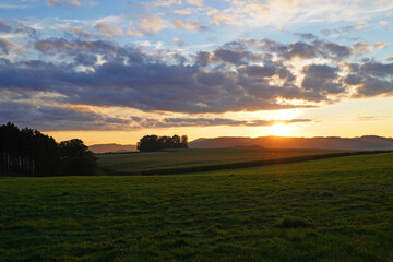 Fototapeta na wymiar Sunset in the Sauerland. Landscape with setting sun in the evening.