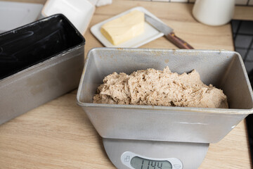 The process of making rye bread. The dough on the rye bread is laid out in a mold. Top view.