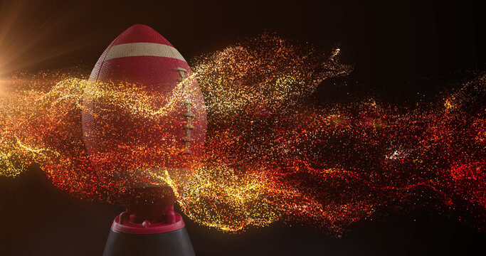 Image of glowing orange particles moving over rugby ball - Powered by Adobe