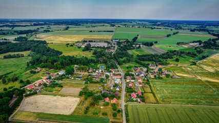 Fototapeta na wymiar Landscape of polish village from above drone footage Kozielice gm Golczewo Poland Church
