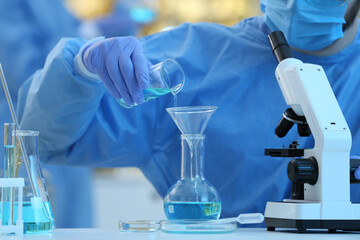 Fototapeta premium Scientist working with sample in laboratory, closeup. Medical research