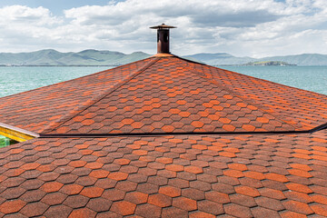 Flexible ruberoid shingles or bitumen tile. Modern roofing material concept