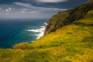 Fotobehang The green coast of Madeira over the Atlantic Ocean photographed in spring. © PawelUchorczak