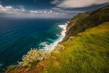 Fototapeta premium The green coast of Madeira over the Atlantic Ocean photographed in spring.