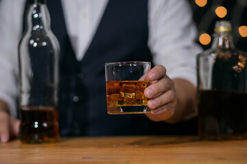 Barman pouring whiskey whiskey glass beautiful night