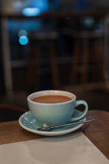 Cocoa cup in the cafe on a table at night time