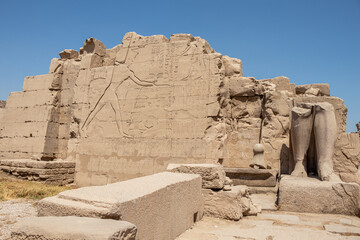Ancient Egyptian murals and writings on the stone walls of the Karnak Temple in Luxor