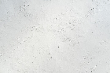 White gray plastered wall background. White concrete background close up. Abrasive white cement background