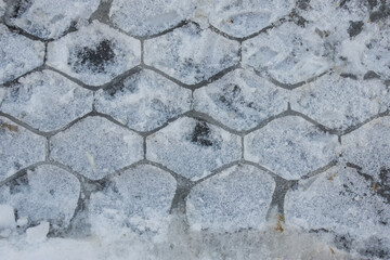 car tire track on ice. Geometric texture on the road close-up