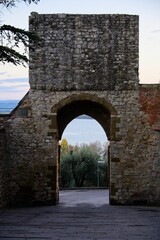 Fototapeta na wymiar Ancient Arch Gate in a Medieval Town in Umbria Italy