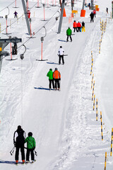 skiers on T-ski lifts, Fiescheralp - ski resort accessible only by cable car from Fiesch, UNESCO...