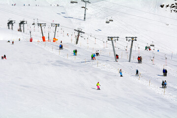 skiers on T-ski lifts and chairlifts, Fiescheralp - ski resort accessible by cable car from Fiesch,...