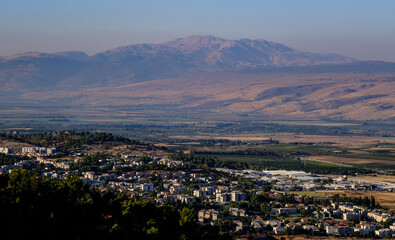 View of Mount Hermon, the Golan Heights, and Hula Valley below as seen from Mount Kana'an above Rosh Pina, Upper Galilee, Northern Israel, Israel. 