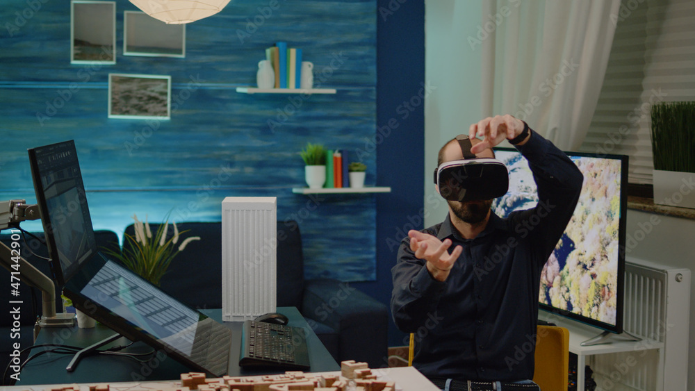 Poster man architect working with vr glasses on building plan development in office. young engineer using t