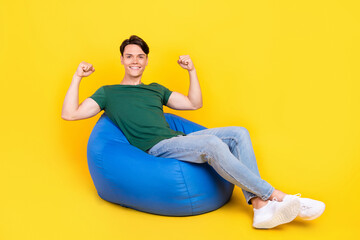 Full length photo of cheerful positive man winner celebrate good mood isolated on yellow color background