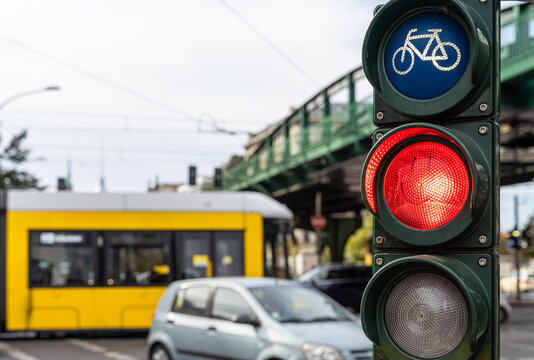 Low Angle View Of Traffic Light Against Tram