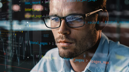 Close-up Portrait of Software Engineer Working on Computer, Line of Code Run Aroung Him. Developer...