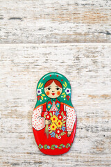 Girl, matreshka, woman in Russian national sundress and a kokoshnik with bouquet of flowers in hand...