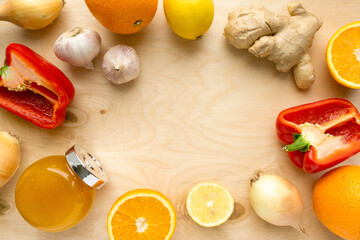 Various products for immunity boosting. Vegetable, fruit and honey on wooden background, copyspace