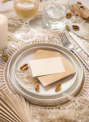 Wedding Table place with Blank card and envelope on bohemian placemat