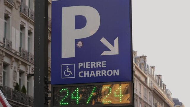Paris parking sign pointer to round the clock underground spot for cars in city center