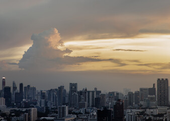 Bangkok, Thailand - Sep 17, 2021 : Aerial view of Beautiful sunset over large metropol city in Asia. With tall building and skyscraper in background. Monotone, No focus, specifically.