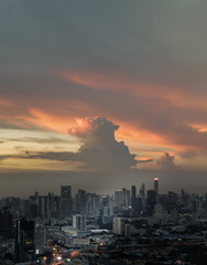 Fototapeta na wymiar Bangkok, Thailand - Sep 17, 2021 : Aerial view of Beautiful sunset over large metropol city in Asia. With tall building and skyscraper in background. Monotone, No focus, specifically.
