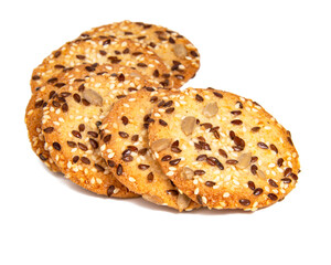 Whole grain snack cereal cookies with seeds isolated on the white background