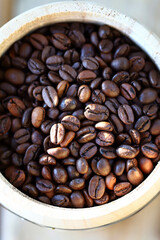 Selective focus. Coffee beans. Roasted arabica and rubust.