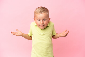 Little Russian boy isolated on pink background with shocked facial expression