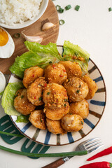 Deep fried cuttlefish ball with salted egg yolk coating