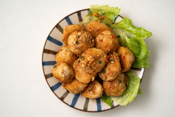 Deep fried cuttlefish ball with salted egg yolk coating