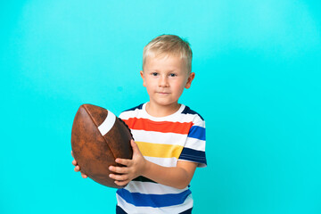 Little Russian boy Playing rugby over isolated background