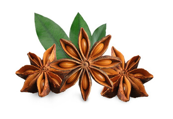 Aromatic dry anise stars and green leaves on white background