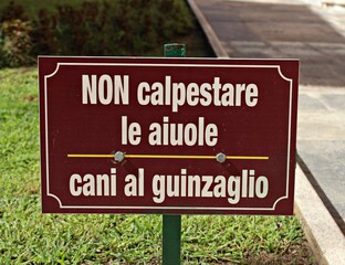 Italy: Road signal (Do not step on the flower beds, dogs on a leash).