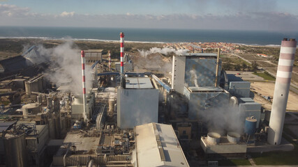 Aerial view of industry metallurgical plant dawn smoke smog emissions environmental disaster pollution 