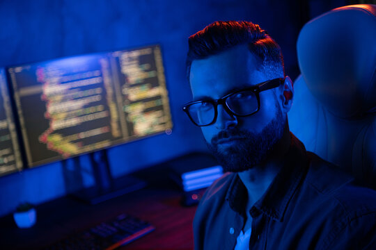 Photo of confident successful operator look camera working midnight business center dark room space