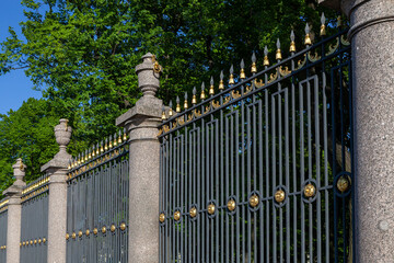 Gilding of the lattice of the Summer Garden in St. Petersburg
