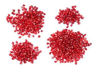 Set with ripe juicy pomegranate seeds on white background, top view