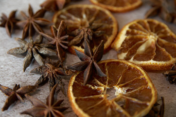 Christmas background of dried fruits and spices. dried, orange, and stars texture background