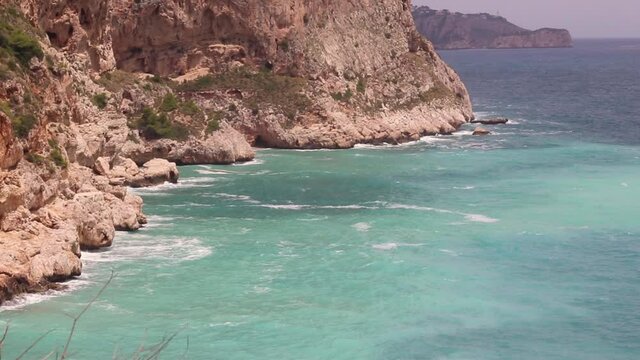 View from above of a cove in Alicante, Spain with clean turquoise water
