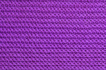 Texture of knitted wool textile. Velvet violet