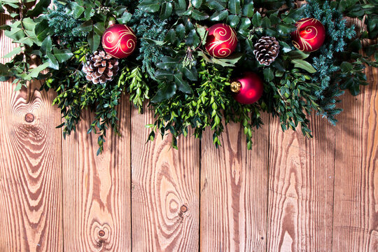 Christmas background with decoration ball , Red celebration balls on wooden board