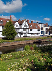 Ancient Half Timbered Buildings facing the gentle River Stour and the Westgate Gardens, in the Historic City of Canterbury, Kent, England, UK