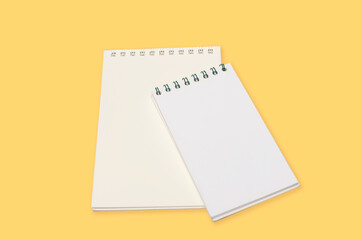 Notebook isolated on yellow  background.Copy space