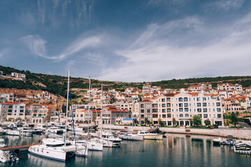 Fototapeta na wymiar Expensive apartments on the marina of Lustica Bay. Montenegro