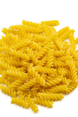 Raw auger pasta isolated on white background. Close-up. vertical view. Story format