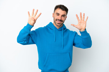Fototapeta premium Young caucasian man isolated on white background counting nine with fingers